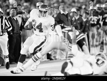 New Jersey Generals' Herschel Walker is held to a six-yard gain by Fred  Nordgren of the Tampa Bay Bandits during the Generals' home opening game at  Giants Stadium in East Rutherford, N.J.