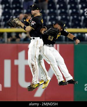 St. Louis, United States. 10th Apr, 2022. Pittsburgh Pirates outfielders  Ben Gamel, Bryan Reynolds (hidden) and Jake Marisnick jump high in the  outfield, celebrating a 9-4 win over the St. Louis Cardinals