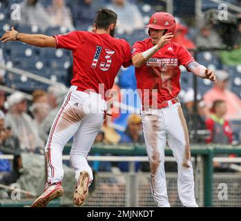 Louisville's Drew Campbell, right, celebrates with Alex Binelas