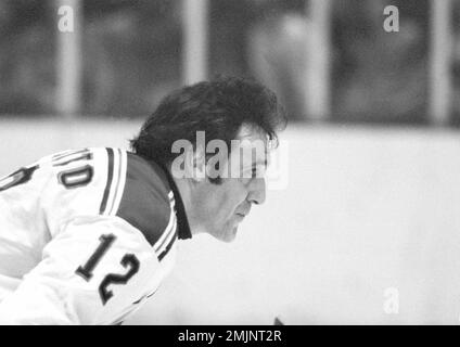 phil-esposito-12-of-the-new-york-rangers-is-pictured-in-action-during-game-against-the-st-louis-blues-at-madison-square-garden-nov-30-1975-other-players-are-unidentified-ap-photo-2mjnt2r.jpg