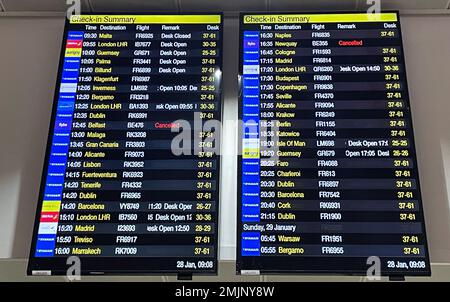 The departure boards at Manchester Airport showing two cancelled Flybe flights as the regional carrier has ceased trading and all scheduled flights have been cancelled, authorities have said. Picture date: Saturday January 28, 2023. Stock Photo