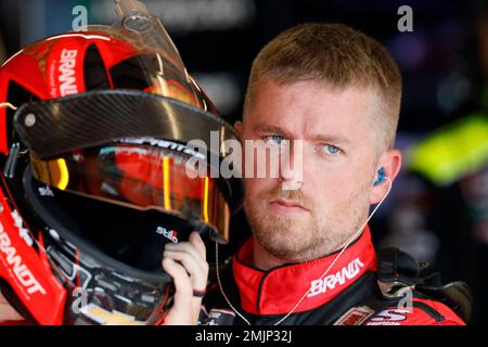 Justin Allgaier puts on his helmet for practice for a NASCAR Xfinity Series auto race, Saturday, June 15, 2019, at Iowa Speedway in Newton, Iowa. (AP Photo/Charlie Neibergall)