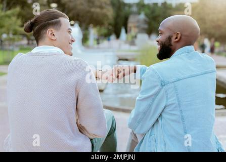 Friends, students and men fist bump together on campus with smile, diversity and hope for future. Friendship, university and happy college people Stock Photo