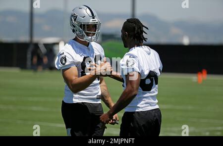 Oakland Raiders wide receiver Antonio Brown holds his son Apollo prior to  an NFL football news conference, Wednesday, March 13, 2019, in Alameda,  Calif. (AP Photo/Ben Margot)