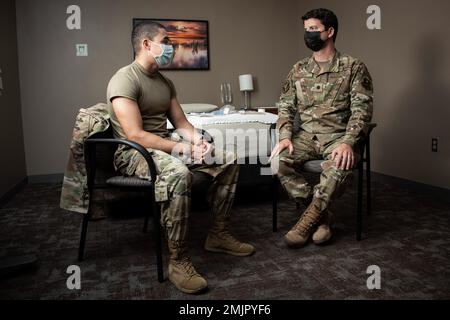 U.S. Air Force Lt. Col. (Dr.) Matthew Brock, chief of the San Antonio Market Sleep Disorders Clinic, consults with patient Airman 1st Class Austin Starks, 59th Medical Specialty Squadron health service management journeyman, before a sleep study at Wilford Hall Ambulatory Surgical Clinic, Joint Base San Antonio-Lackland, Texas, Aug. 31, 2022. Brock was the lead author on a study, which has identified a new sleep disorder that’s been disrupting the lives of trauma survivors for decades, if not centuries. While there have been related studies, this was the largest to date and identifies trauma a Stock Photo