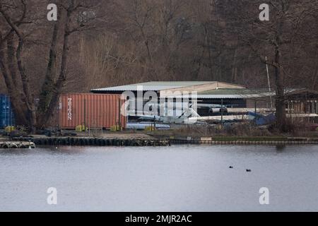 Harefield, Uxbridge, UK. 27th January, 2023. HS2 High Speed Rail construction work for the viaduct of sheet piling, installing cofferdams and jetty building have taken place across Harefield Lake No 2. Rotary piling for the ground and lake piers is now underway. The popular  Hillingdon Outdoor Activities Centre (pictured) for sailing and boating on the lake has been permanently closed due to HS2. It has been widely reported in the press today that there is a possibility that HS2 could terminate in West London and not Euston due to costs, however, Chancellor Jeremy Hunt has denied this and said Stock Photo