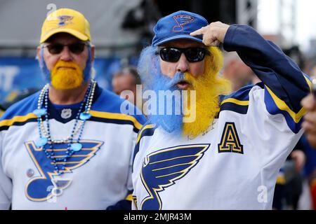 St. Louis Blues President John Davidson waves to the fans as he is