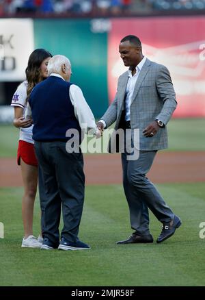 Retired player Adrian Beltre, from left, his wife Sandra, son Adrian Jr.,  daughters Camila and Cassandra, right, acknowledge cheers from fans during  a retirement ceremony for Betlre's jersey before the second baseball