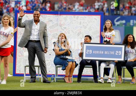 Former baseball player Adrian Beltre, left, greets former teammate Félix  Hernández after he was inducted into the Mariners Hall of Fame during a  ceremony before a baseball game between the Mariners and