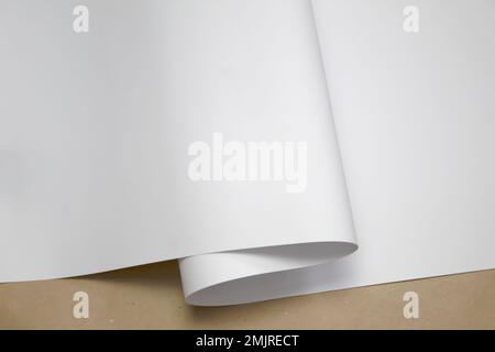 white wrapping paper, mock up, template on brown kraft paper Stock Photo