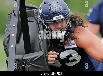 Seattle Seahawks center Joey Hunt (62) and offensive tackle Jalen McKenzie ( 76) run a drill during the NFL football team's training camp, Wednesday,  Aug. 9, 2023, in Renton, Wash. (AP Photo/Lindsey Wasson