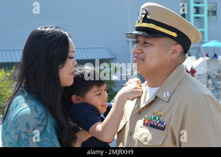 Norfolk, Va. (September 1, 2022). Lt. Aaron Antonio, assigned to the San Antonio-Class Amphibious Transport Dock USS New York (LPD 21), is promoted to Lieutenant Commander during a ceremony aboard the decommissioned Iowa-Class Battleship USS Wisconsin (BB 64). The ceremony occurred in front of the Battleship’s iconic turret No. 1 and was attended by members of his family and command. The ceremony was hosted and coordinated by the Hampton Roads Naval Museum, one of ten U.S. Navy museums within the Naval History and Heritage Command. The museum offers military ceremonies for area commands withou Stock Photo