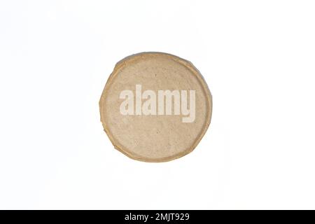 Torn sheet of old round paper. Round piece of torn vintage paper. Stock Photo