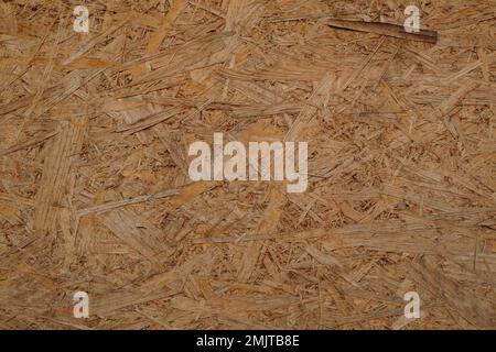 Closeup of OSB (oriented strand board) construction material. Rough texture background. Stock Photo