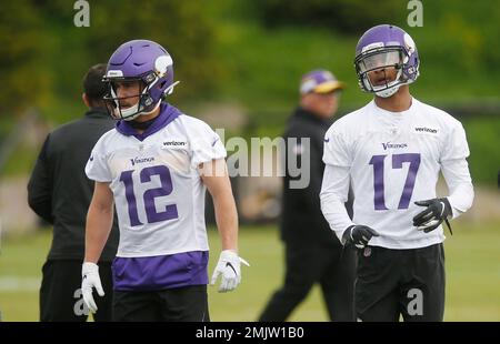 Minnesota Vikings wide receivers Brandon Zylstra, left, and Chad Beebe run  during calisthenics at the NFL football team's training camp Monday, July  29, 2019, in Eagan, Minn. (AP Photo/Jim Mone Stock Photo 