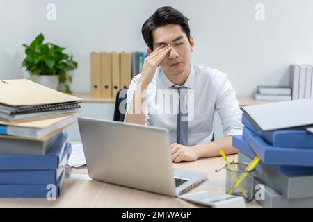 Business men in the office to work overtime Stock Photo