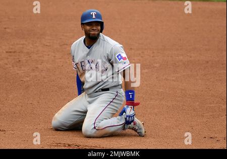 Texas Rangers' Elvis Andrus smiles as he looks on at play during a