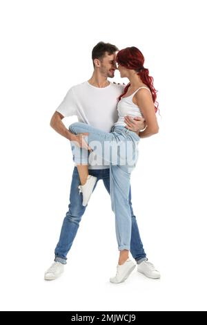 Beautiful young couple dancing on white background Stock Photo - Alamy
