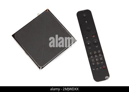 Modern Iptv box and black remote controller multimedia device for viewing television via Internet multimedia player and control panel Stock Photo