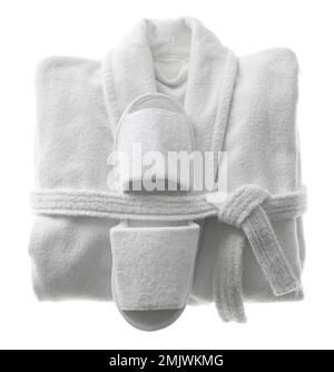 Clean folded bathrobe and slippers isolated on white, top view Stock Photo