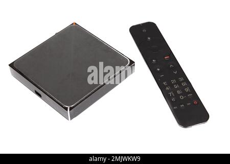 digital TV tuner television via Internet with remote control modern black on white background Stock Photo