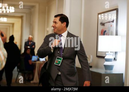 San Francisco 49ers chief executive officer Jed York, middle, talks with Denver  Broncos owners Carrie Walton Penner, left, and Rob Walton before an NFL  football game in Denver, Sunday, Sept. 25, 2022. (