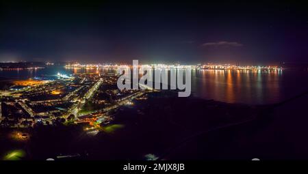An aerial view of the ports of Harwich and Felixstowe at night in the UK Stock Photo
