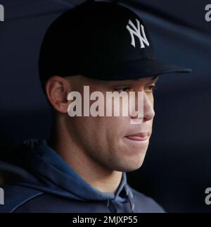 Injured New York Yankees outfielder Aaron Judge spits a seed as he watches  from the dugout during the fourth inning of a baseball game against the  Seattle Mariners, Saturday, Sept. 8, 2018