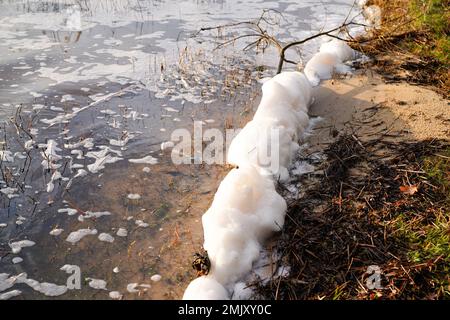 chemical origin on the surface polluted foam dirty water pollution junk beach Stock Photo