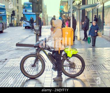 Glasgow, Scotland, UK 28tht January, 2023. UK Weather:   Just eat delivery bike cyclist Cold and wet saw the streets being unwelcoming as the city centre needs a makeover or at least a clean up. Credit Gerard Ferry/Alamy Live News Stock Photo