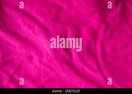 pleated cotton fabric pink background color t-shirt texture Stock Photo