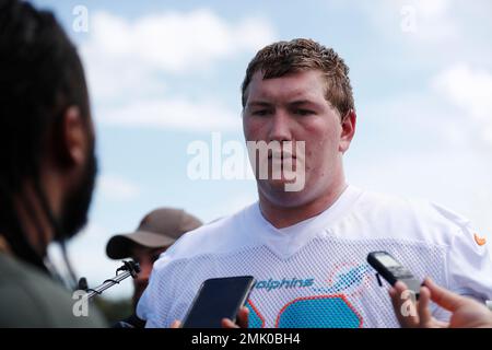 Miami Dolphins offensive lineman Michael Deiter (63) talks with Miami  Dolphins quarterback Teddy Bridgewater on the sidelines during an NFL  football game against the Houston Texans, Sunday, Nov. 27, 2022, in Miami