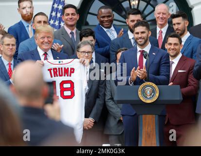 President Donald Trump receives a jersey with his name from Boston Red Sox J.D.  Martinez, Right Fielder, right, as he welcomes the 2018 World Series  Champions to the White House, The Boston