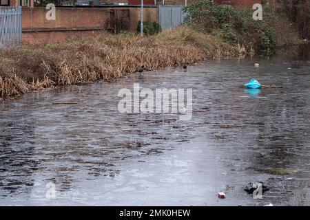 Slough, Berkshire, UK. 28th January, 2023. Ice on the Slough Arm of the Grand Union Canal. Temperatures were below freezing again last night, however, the temperatures are due to rise in the next few days. Credit: Maureen McLean/Alamy Live News Stock Photo