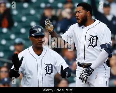 Detroit Tigers' Ronny Rodriguez, right, greets Daryl Patterson, a