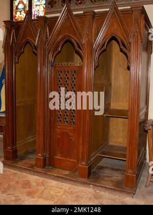 wood confessional in a catholic church Stock Photo