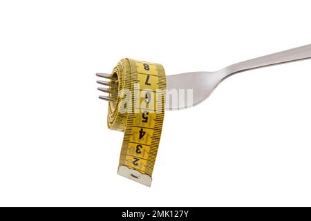 Fork with yellow measuring tape isolated on white background with clipping path. Concept of proper, balanced nutrition diet. Stock Photo