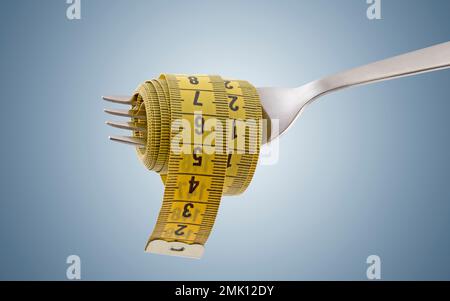 Fork with yellow measuring tape on light blue background. Concept of proper, balanced nutrition diet. Stock Photo