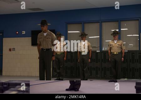 U.S. Marine Corps drill instructors with Lima Company, 3rd Recruit Training Battalion, meet their new recruits on Marine Corps Recruit Depot Parris Island, S.C., Sept. 2, 2022. Lima Company will spend Forming Day learning the rules and regulations of recruit training. Stock Photo