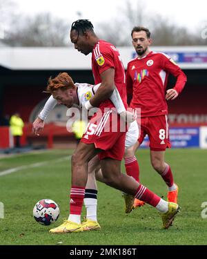 Salford City's Callum Morton (centre) and Crawley Town's Ludwig Francillette battle for the ball during the Sky Bet League Two match at Broadfield Stadium, Crawley. Picture date: Saturday January 28, 2023. Stock Photo