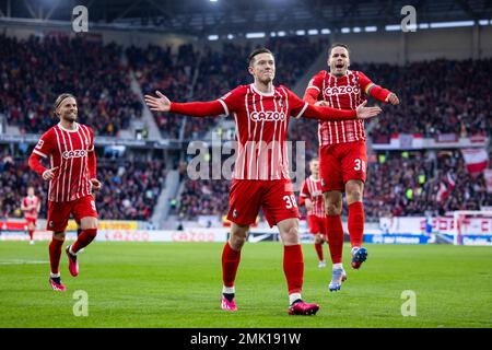 Freiburg Im Breisgau, Germany. 28th Jan, 2023. Soccer: Bundesliga, SC Freiburg - FC Augsburg, Matchday 18, Europa-Park Stadion. Freiburg's Michael Gregoritsch (M) celebrates with Freiburg's Lucas Höler (l) and Freiburg's Christian Günter (r) after his goal for 1:0. Credit: Tom Weller/dpa - IMPORTANT NOTE: In accordance with the requirements of the DFL Deutsche Fußball Liga and the DFB Deutscher Fußball-Bund, it is prohibited to use or have used photographs taken in the stadium and/or of the match in the form of sequence pictures and/or video-like photo series./dpa/Alamy Live News Stock Photo