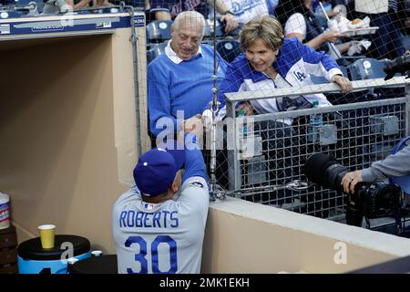 Former manager Tommy Lasorda and his wife Jo Lasorda walk on the field as  the Dodgers