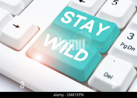 Sign displaying Stay Wild. Concept meaning keep being you and