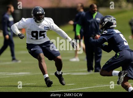 Seattle Seahawks defensive end L.J. Collier, (95), walks with his fiancé,  Samantha Lane, after the first day of NFL football rookie mini camp,  Friday, May 3, 2019, in Renton, Wash. (AP Photo/Ted