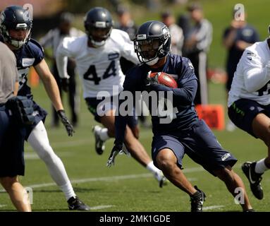 Seattle Seahawks running back Tony Jones Jr. (32) and Los Angeles Rams  running back Kyren Williams (23) hold up their jerseys following an NFL  football game Sunday, Dec. 4, 2022, in Inglewood