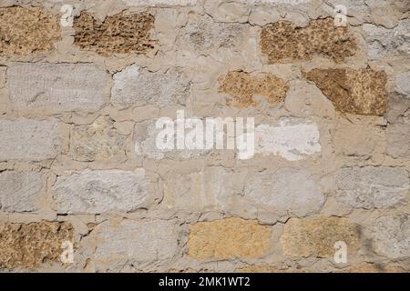 rough wall from blocks of shell rock Stock Photo