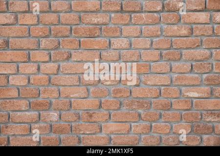 brown wall made of brick with rounded edges Stock Photo
