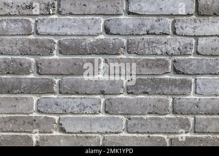 dark wall made of ash color bricks Stock Photo