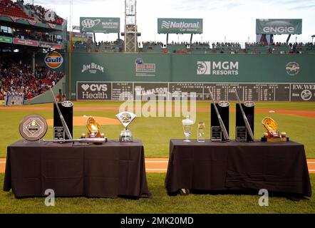 Boston Red Sox's Mookie Betts, left, J.D. Martinez, center, and Jackie  Bradley Jr. stand with their various 2018 awards including Silver Sluggers,  Gold Gloves and the AL MVP before a baseball game