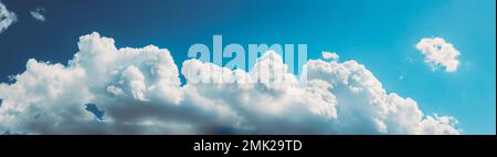 Natural Day Cloudy Sky Abstract Background. Bright Colorful Panorama Of Cloudy Sky. Panoramic View Of Cumulus Clouds. Abstract Light Blue Color. Copy Stock Photo